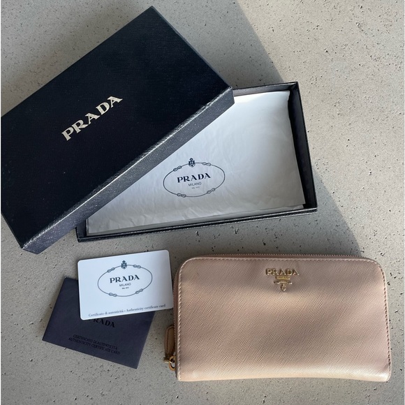 Prada Handbags - PRADA nude prada saffiano zip wallet